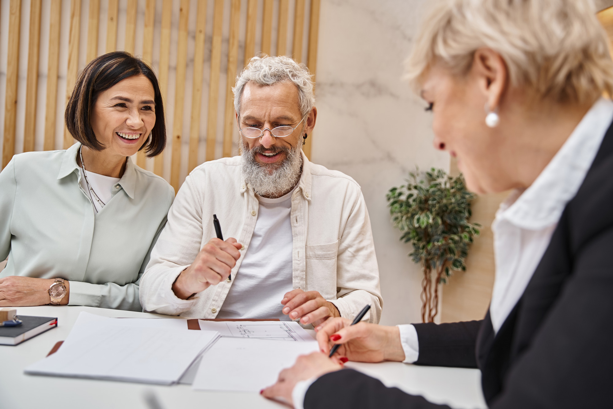 Clients signing real estate settlement documents